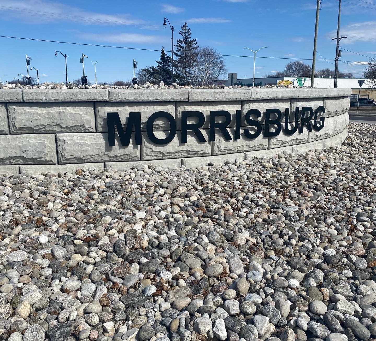 Sign for Morrisburg surrounded by rocks.
