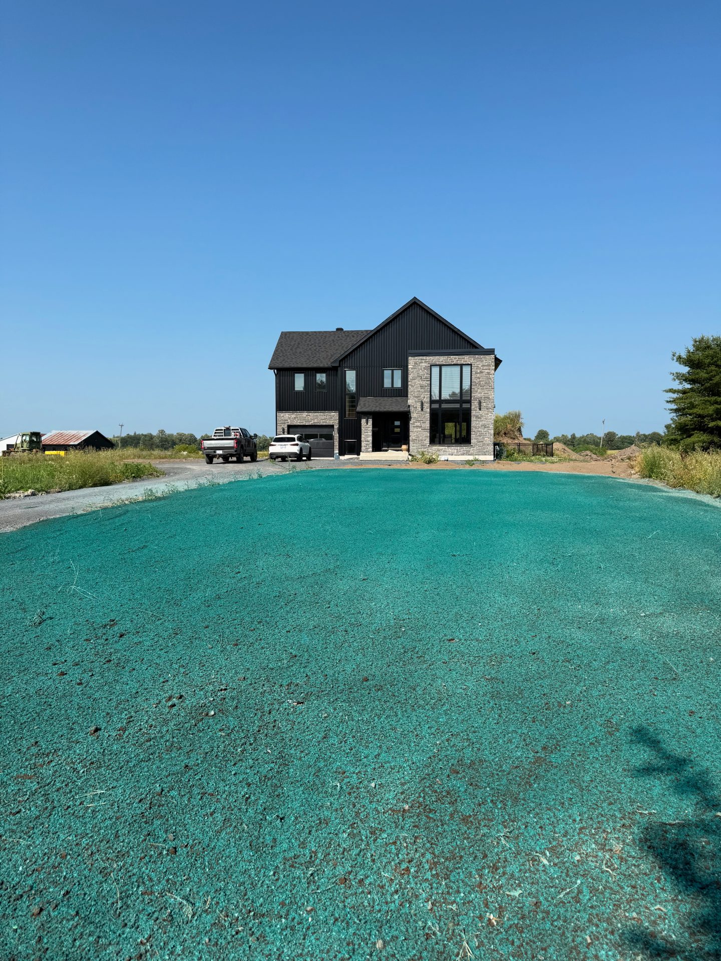 Modern house with newly seeded lawn.