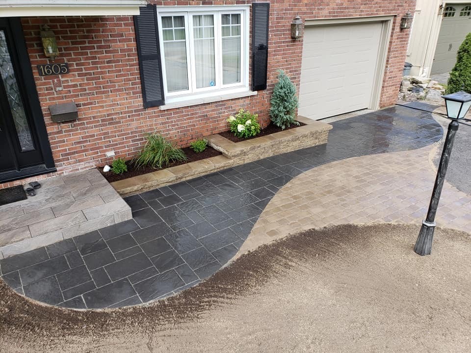 Brick house with modern stone walkway and driveway