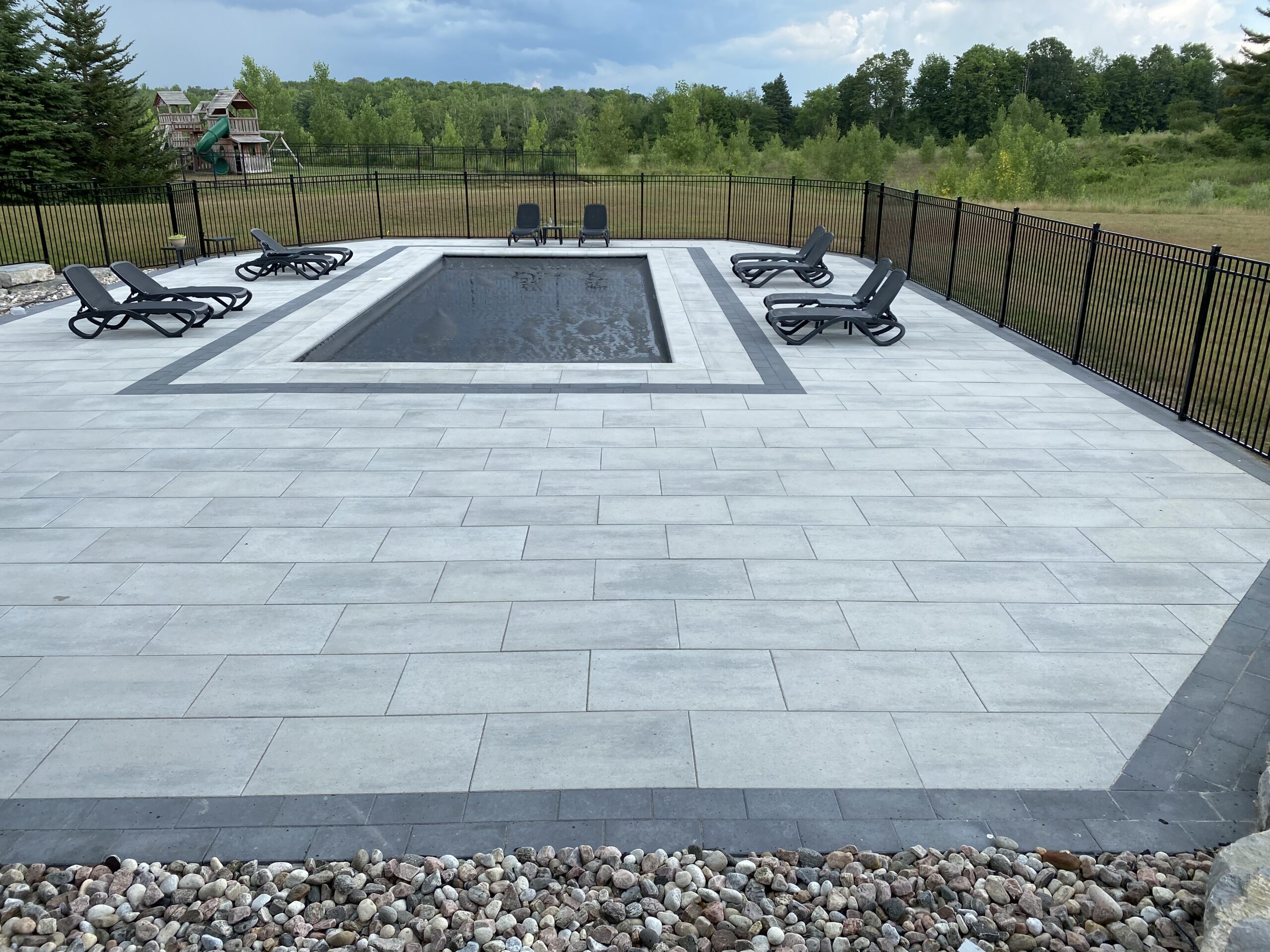 Patio with pool and lounge chairs