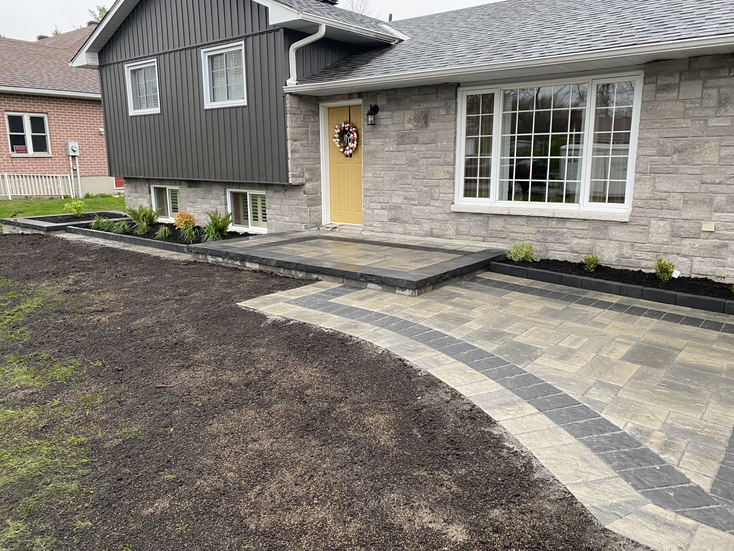 Front yard with new walkway and landscaping.