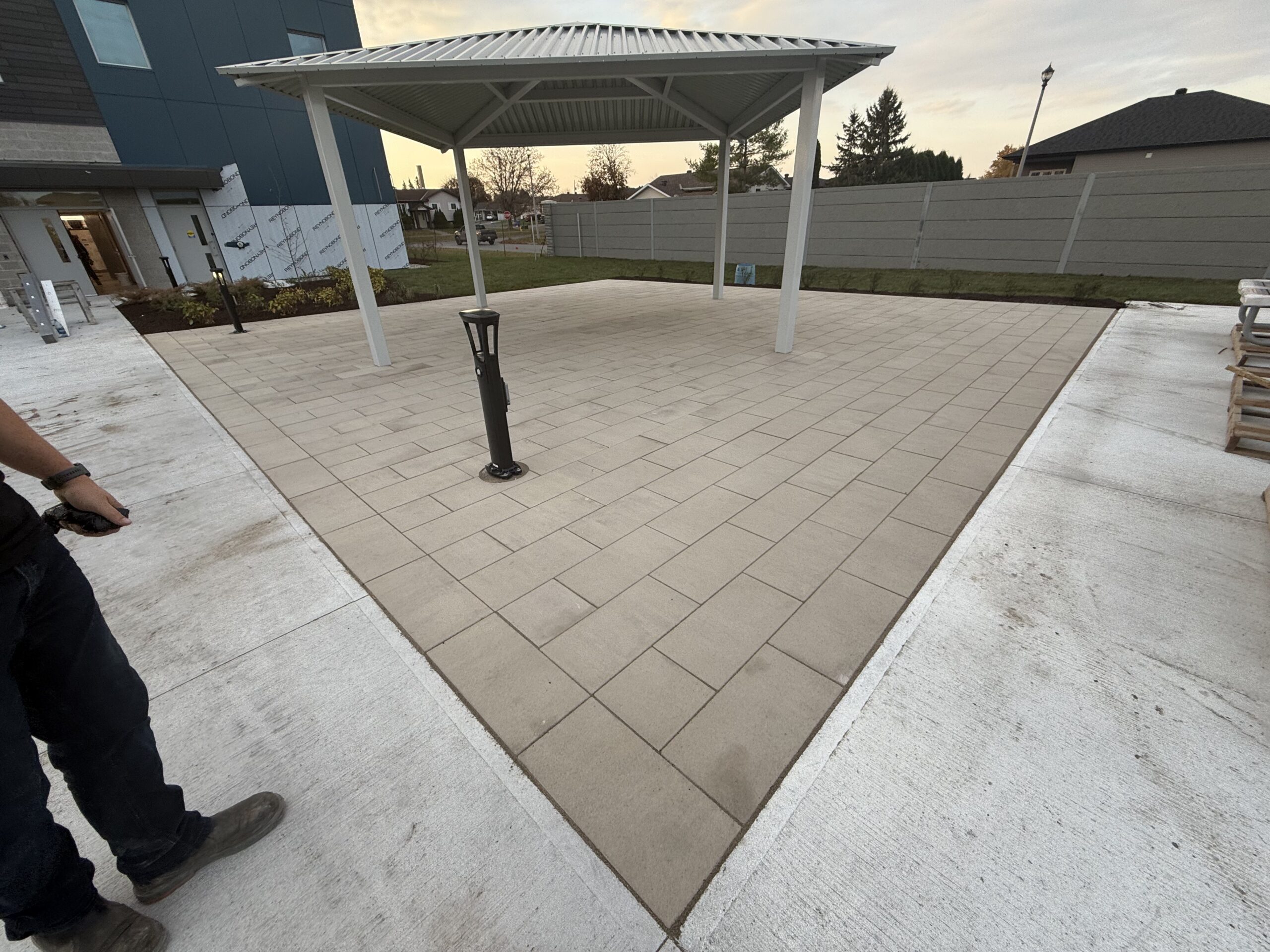 Small gazebo on paved patio area.