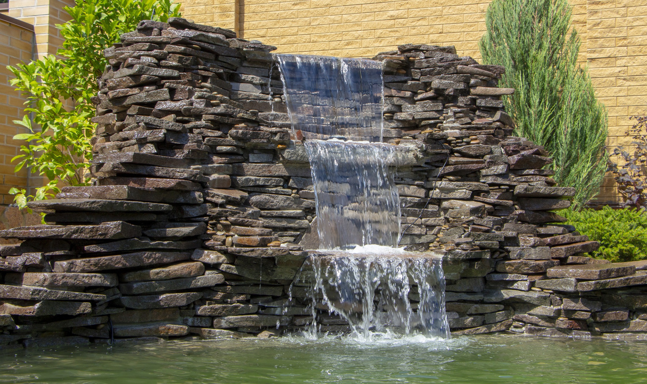 Stone waterfall feature in a garden