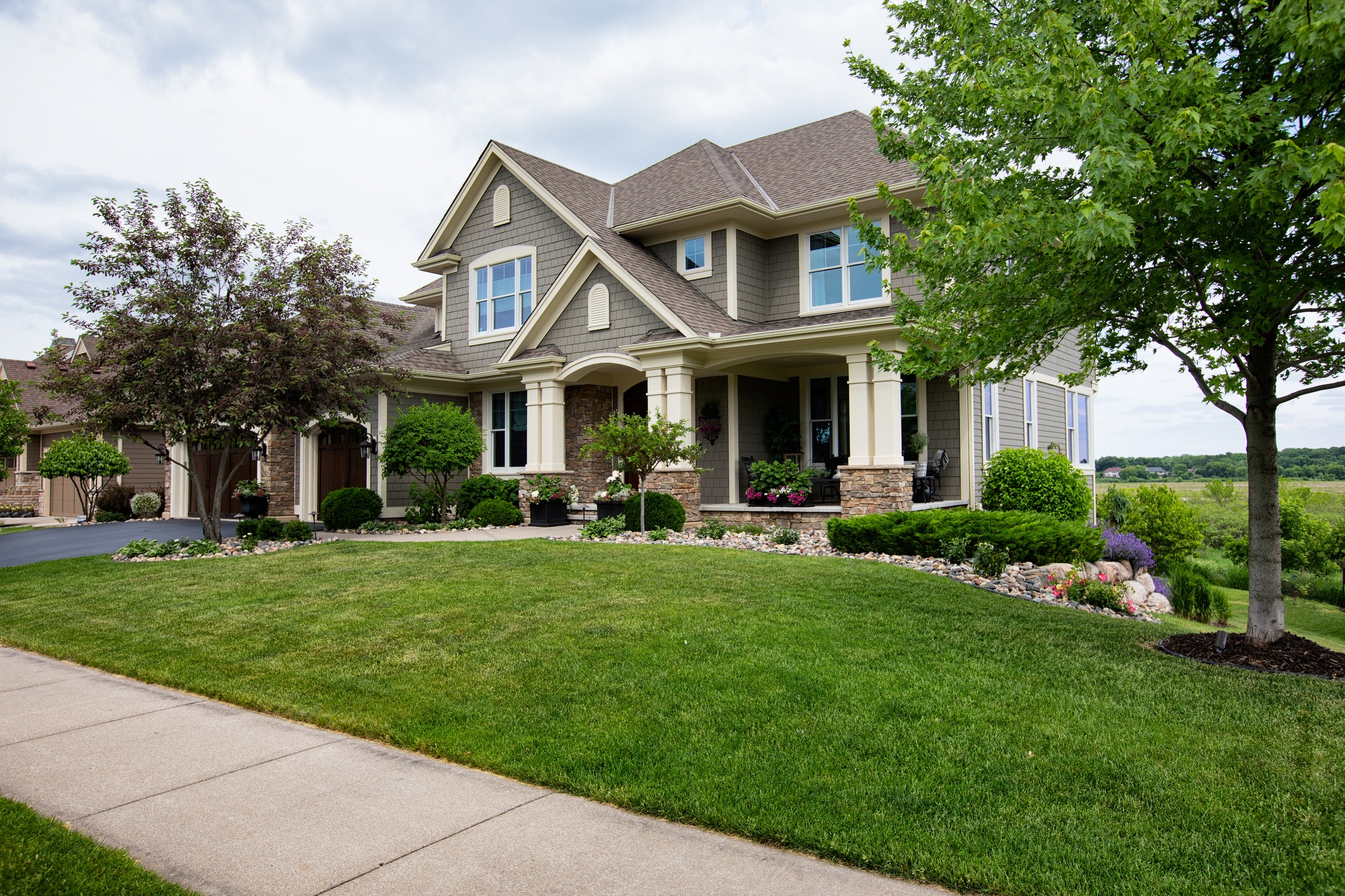 Suburban house with lush green lawn.
